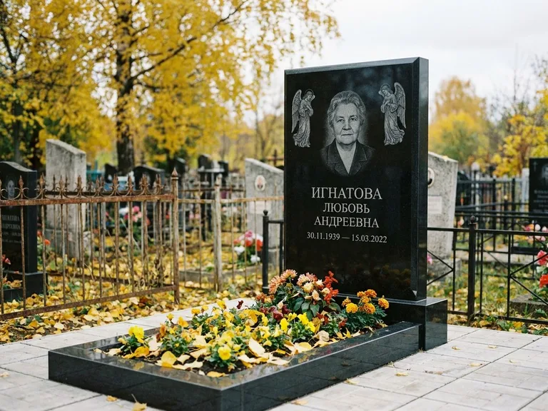 Памятник с гравировкой ангела — гравировка двух ангелов по сторонам портрета, работа «Игнатова» в Москве