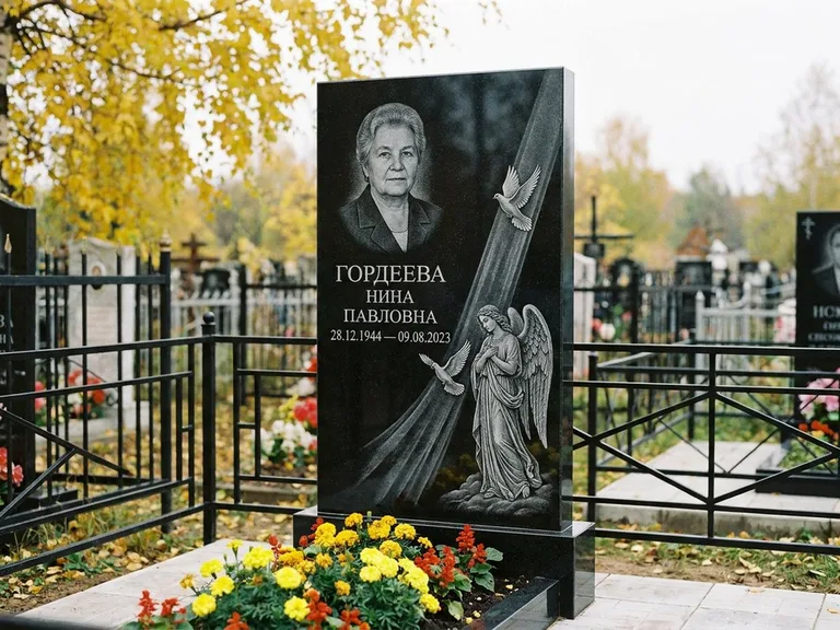 Памятник с гравировкой ангела — гравировка ангела с голубем по диагонали стелы, работа «Гордеева» в Москве